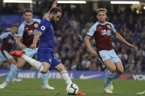 Chelsea's Gonzalo Higuain scores his side's second goal during the English Premier League soccer match between Chelsea and Burnley at Stamford Bridge stadium in London, Monday, April 22, 2019. (AP Photo/Kirsty Wigglesworth)