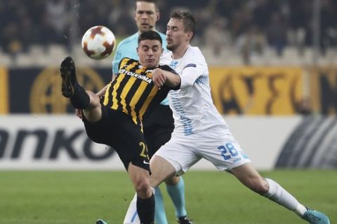 AEK Athens' Kostas Galanopoulos, left, and Rijeka's Filip Bradaric challenge for the ball during the Europa League group D soccer match between AEK Athens and Rijeka at the Olympic stadium, in Athens, Thursday, Nov. 23, 2017. (AP Photo/Petros Giannakouris)