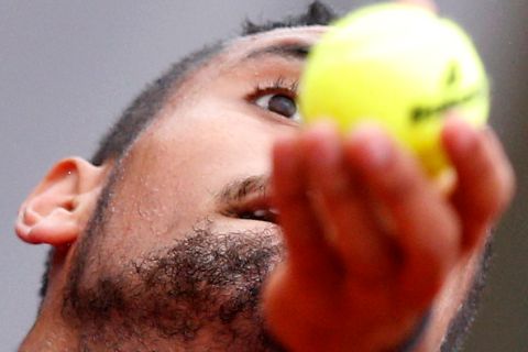 Australia's Nick Kyrgios serves during the first round of the French Open tennis tournament against Italys Marco Checchinato at Roland Garros stadium in Paris, France, Sunday, May 22, 2016. (AP Photo/Christophe Ena)
