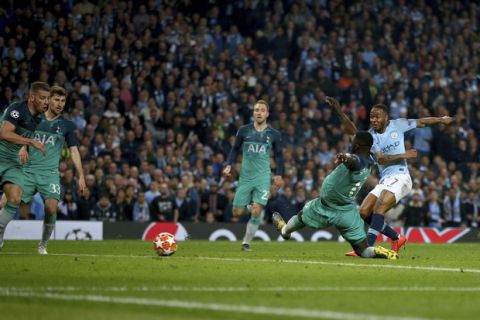 Manchester City's Raheem Sterling, right, scores what would have been the winning goal for it to then be disallowed for offside against Manchester City's Sergio Aguero, not pictured, following a VAR review during the Champions League quarterfinal, second leg, soccer match between Manchester City and Tottenham Hotspur at the Etihad Stadium in Manchester, England, Wednesday, April 17, 2019. (AP Photo/Dave Thompson)
