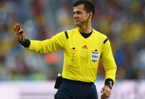 CURITIBA, BRAZIL - JUNE 16:  Referee Carlos Vera gestures during the 2014 FIFA World Cup Brazil Group F match between Iran and Nigeria at Arena da Baixada on June 16, 2014 in Curitiba, Brazil.  (Photo by Julian Finney/Getty Images)