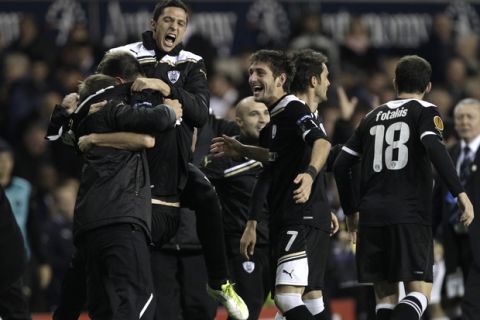 PAOK's Georgios Georgiadis, center, celebrates with his teammates after the Europa League Group A soccer match between Tottenham and PAOK at White Hart Lane stadium in London, Wednesday, Nov. 30, 2011. (AP Photo/Matt Dunham)