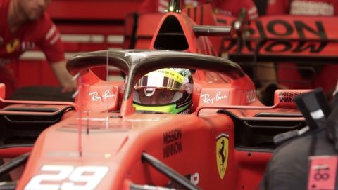 Mick Schumacher prepares for his first F1 test for Ferrari at the Bahrain International Circuit in Sakhir, Bahrain, Tuesday, April 2, 2019. Mick Schumacher has moved closer to emulating his father Michael by driving a Ferrari Formula One car in an official test. Schumacher's father won seven F1 titles, five of those with Ferrari and holds the record for race wins with 91. (AP Photo/Hassan Ammar)