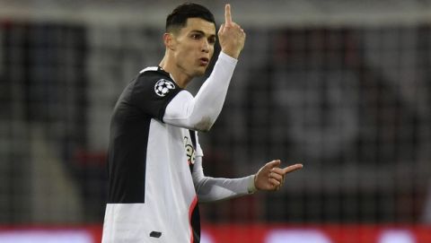 Juventus' Cristiano Ronaldo reacts during the Champions League Group D soccer match between Bayer Leverkusen and Juventus at the BayArena in Leverkusen, Germany, Wednesday, Dec. 11, 2019. (AP Photo/Martin Meissner)