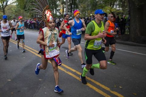 Runners take part in the New York City Marathon, Sunday, Nov. 3, 2019, in New York. (AP Photo/Eduardo Munoz Alvarez)
