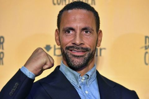 Ex-footballer Rio Ferdinand poses for the media during a press conference at York Hall, London, Tuesday, Sept. 19, 2017. Former England and Manchester United defender Rio Ferdinand is looking to become a professional boxer. The 38-year-old Ferdinand will be trained by former WBC super-middleweight champion Richie Woodhall, who has worked with Britain's Olympic team. The retired soccer player's move into boxing is linked to a betting company renowned for stunts. (Dominic Lipinski/PA via AP)