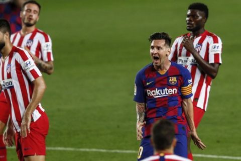 Barcelona's Lionel Messi reacts after missing a shoot during the Spanish La Liga soccer match between FC Barcelona and Atletico Madrid at the Camp Nou stadium in Barcelona, Spain, Tuesday, June 30, 2020. (AP Photo/Joan Monfort)