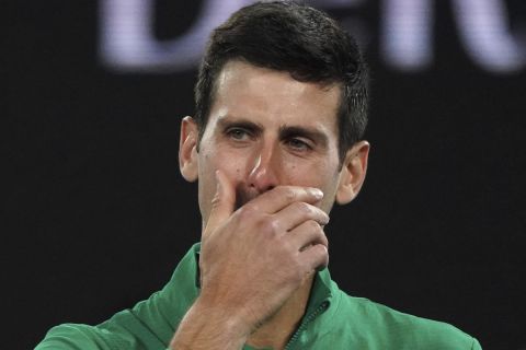 Serbia's Novak Djokovic reacts as he talks about the death of his friend Kobe Bryant as he is interviewed on court following his quarterfinal win over Canada's Milos Raonic at the Australian Open tennis championship in Melbourne, Australia, Tuesday, Jan. 28, 2020. (AP Photo/Lee Jin-man)