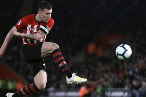 Southampton's Pierre-Emile Hojbjerg kicks the ball during the English Premier League soccer match between Southampton and Liverpool at St Mary's stadium in Southampton, England Friday, April 5, 2019. (AP Photo/Kirsty Wigglesworth)