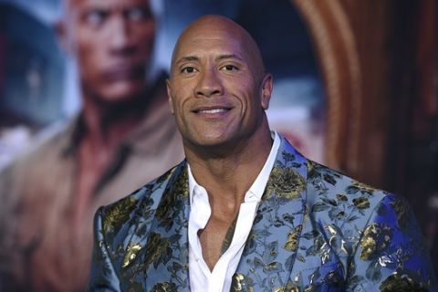 Cast member Dwayne Johnson arrives at the Los Angeles premiere of "Jumanji: The Next Level," at the TCL Chinese Theatre, Monday, Dec. 9, 2019. (Photo by Jordan Strauss/Invision/AP)