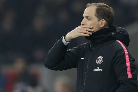 PSG's coach Thomas Tuchel watches his team during the French League One soccer match between OSC Lille and Paris Saint-Germain at Stade Pierre Mauroy in Lille, France, Sunday, April 14, 2019.(AP Photo/Christophe Ena)