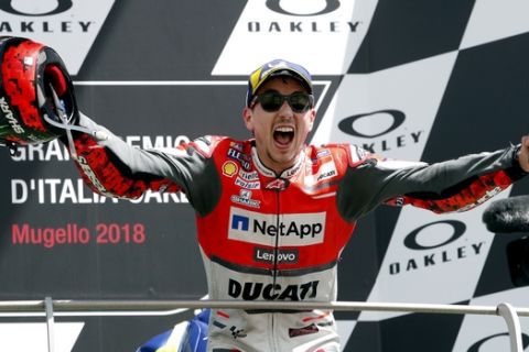 Spain's rider Jorge Lorenzo of the Ducati Team celebrates his victory in the MotoGP race at the Italian Moto GP grand prix at the Mugello circuit, in Scarperia, Italy, Sunday, June 3, 2018. (AP Photo/Antonio Calanni)