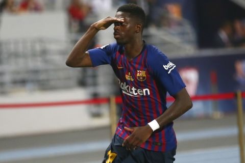 Barcelona's Ousmane Dembele celebrates after scoring his side's second goal during the Spanish Super Cup soccer match between Sevilla and Barcelona in Tangier, Morocco, Sunday, Aug. 12, 2018. (AP Photo/Mosa'ab Elshamy)