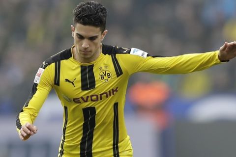 FILE - In this file photo dated Saturday, March 11, 2017, Dortmund's Marc Bartra plays the ball during the German Bundesliga soccer match between Hertha BSC Berlin and Borussia Dortmund in Berlin, Germany. Borussia Dortmund said Tuesday April 11, 2017, defender Marc Bartra was injured in an explosion near team bus and is currently in a hospital. (AP Photo/Michael Sohn, FILE)