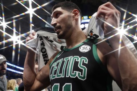 In this photo taken with a star filter, Boston Celtics' Enes Kanter leaves the court after their win in an NBA basketball game against the New Orleans Pelicans Saturday, Jan. 11, 2020, in Boston. (AP Photo/Winslow Townson)