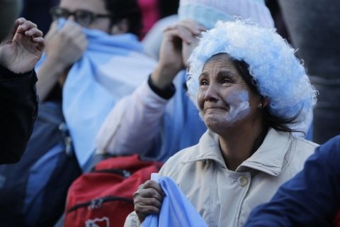 Argentina fans react in disbelief at the end of a televised broadcast of the Croatia vs Argentina World Cup soccer match, in Buenos Aires, Argentina, Thursday, June 21, 2018. Argentina lost 3-0 to Croatia. (AP Photo Jorge Saenz)