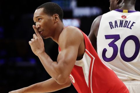Los Angeles Clippers forward Wesley Johnson, left, celebrates a basket past Los Angeles Lakers forward Julius Randle during the second half of an NBA basketball game in Los Angeles, Friday, Dec. 25, 2015. The Clippers won 94-84. (AP Photo/Chris Carlson)