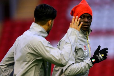LIVERPOOL, ENGLAND - OCTOBER 21:  Mario Balotelli of Liverpool runs next to team-mate Emre Can during a training session ahead of the UEFA Champions League group B match between Liverpool FC and Real Madrid CF at Anfield on October 21, 2014 in Liverpool, United Kingdom.  (Photo by Alex Livesey/Getty Images)