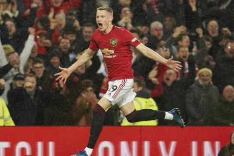 Manchester United's Scott McTominay celebrates after scoring his side's second goal during the English Premier League soccer match between Manchester United and Manchester City at Old Trafford in Manchester, England, Sunday, March 8, 2020. (AP Photo/Dave Thompson)