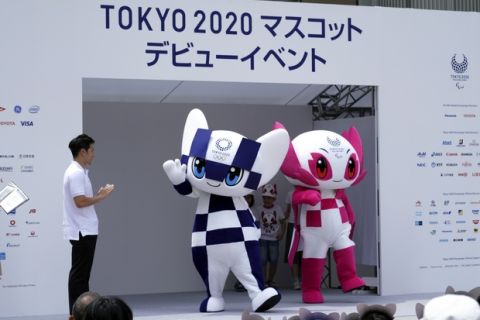 Tokyo 2020 Olympic mascot "Miraitowa", left, and Paralympic mascot "Someity", right, appear at stage during their debut event in Tokyo Sunday, July 22, 2018. The official mascots for the Tokyo 2020 Olympics and Paralympics were unveiled at a ceremony on Sunday. The two mascot designs were selected by elementary schoolchildren across Japan. (AP Photo/Eugene Hoshiko)