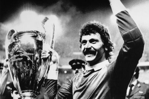 FILE - In this May 7, 1986 file photo jubilant Steaua Bucharest goalkeeper Helmuth Duckadam raises the European Champions Cup after the Romainian team defeated Barcelona in penalties in Seville, Spain. S is for Steaua Bucharest. Steaua beat hot favorites Barcelona on penalties with goalkeeper Helmuth Duckadam being labelled 'The Hero of Seville. It was the first European Cup final to finish goalless and remains Steaua's only European Cup triumph, and the first of only two won by an Eastern European club. (AP Photo/Fernando Ricardo, File)