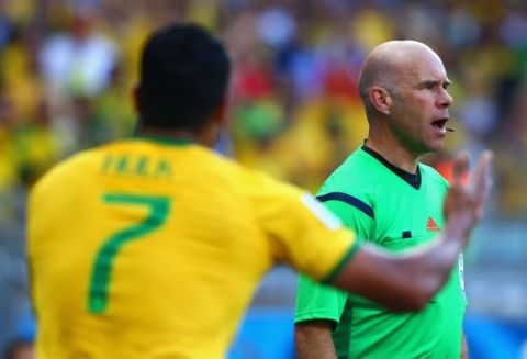 BELO HORIZONTE, BRAZIL - JUNE 28:  Hulk of Brazil appeals to assistant referee Michael Mullarkey after a disallowed goal and yellow card due to a hand ball during the 2014 FIFA World Cup Brazil round of 16 match between Brazil and Chile at Estadio Mineirao on June 28, 2014 in Belo Horizonte, Brazil.  (Photo by Jeff Gross/Getty Images)