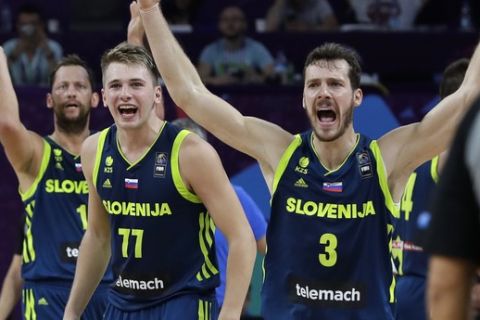Slovenia's Luka Doncic and Goran Dragic, right, react during their Eurobasket European Basketball Championship semifinal match against Spain in Istanbul, Thursday, Sept. 14, 2017. (AP Photo/Thanassis Stavrakis)