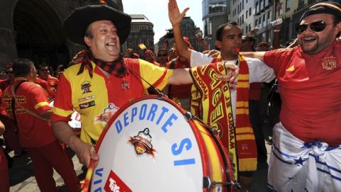 Manolo beats his drum along side other supporters of Spain's national soccer team at the Stephansplatz in Vienna,in Vienna, Sunday, June 22, 2008, prior to the quarterfinal match between Spain and Italy at the Euro 2008 European Soccer Championships in Austria and Switzerland. (AP Photo/Oliver Multhaup)