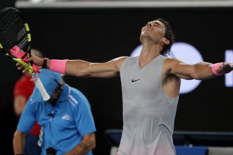Spain's Rafael Nadal celebrates after defeating Damir Dzumhur of Bosnia and Herzegovina in their third round match at the Australian Open tennis championships in Melbourne, Australia, Friday, Jan. 19, 2018. (AP Photo/Vincent Thian)
