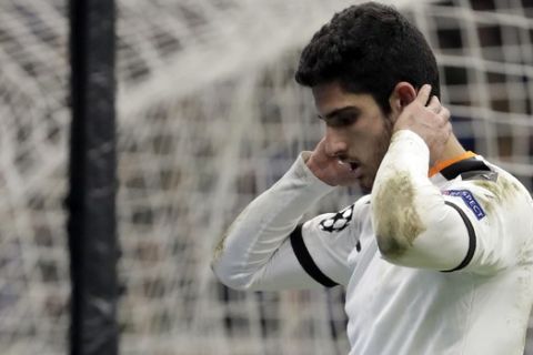 Valencia's Goncalo Guedes reacts after missing a chance to score during the Champions League round of 16, first leg, soccer match between Atalanta and Valencia at the San Siro stadium in Milan, Italy, Wednesday, Feb. 19, 2020. (AP Photo/Luca Bruno)