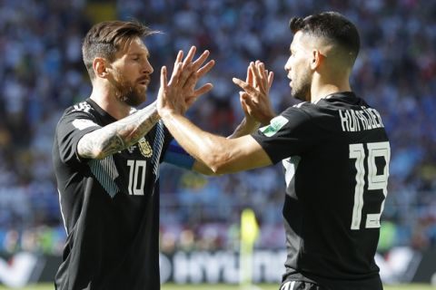 Argentina's Sergio Aguero, right, and Lionel Messi celebrate after scoring their side's first goal during the group D match between Argentina and Iceland at the 2018 soccer World Cup in the Spartak Stadium in Moscow, Russia, Saturday, June 16, 2018. (AP Photo/Victor Caivano)