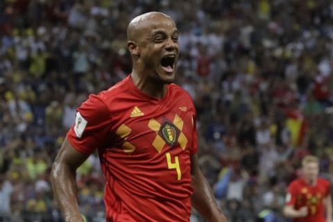 Belgium's Vincent Kompany celebrates after Brazil's Fernandinho scored an own goal during the quarterfinal match between Brazil and Belgium at the 2018 soccer World Cup in the Kazan Arena, in Kazan, Russia, Friday, July 6, 2018. (AP Photo/Andre Penner)