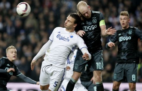 Copenhagen's Erik Johansson, second left, fights for the ball and Ajaxs Davy Klaassen, second right and Daley Sinkgraven during the Europa League round of 16 first leg soccer match between FC Copenhagen and Ajax Amsterdam at Parken, Copenhagen, Thursday, March 9, 2017. (Jens Dresling/Polfoto via AP)