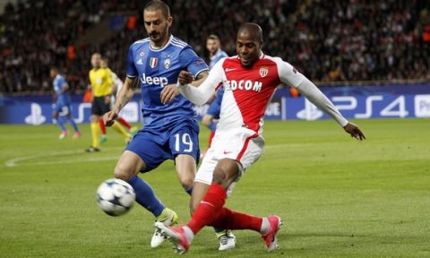 Juventus' Leonardo Bonucci, left, challenges for the ball with Monaco's Djibril Sidibe during the Champions League semifinal first leg soccer match between Monaco and Juventus at the Louis II stadium in Monaco, Wednesday, May 3, 2017. (AP Photo/Claude Paris)