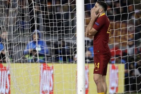 Roma's Kostas Manolas reacts after missing a scoring chance during a Champions League, Group G soccer match between Roma and Real Madrid at the Rome Olympic stadium, Tuesday, Nov. 27, 2018. (AP Photo/Gregorio Borgia)