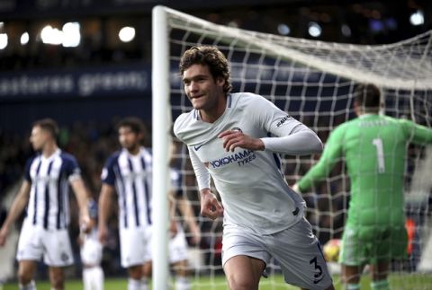 Chelsea's Marcos Alonso celebrates scoring his side's third goal against West Bromwich Albion during the English Premier League soccer match at The Hawthorns, West Bromwich, England, Saturday Nov. 18, 2017. (Nick Potts/PA via AP)