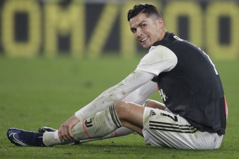Juventus' Cristiano Ronaldo smiles during a Serie A soccer match between Juventus and Bologna, at the Allianz stadium in Turin, Italy, Saturday, Oct.19, 2019. (AP Photo/Luca Bruno)