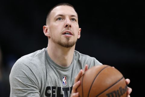Boston Celtics' Daniel Theis warms up before Game 6 of the NBA basketball Eastern Conference finals playoff series against the Miami Heat, Friday, May 27, 2022, in Boston. (AP Photo/Michael Dwyer)