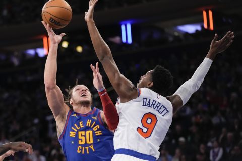 Denver Nuggets forward Aaron Gordon (50) shoots over New York Knicks guard RJ Barrett (9) during the first half of an NBA basketball game, Saturday, March 18, 2023, at Madison Square Garden in New York. (AP Photo/Mary Altaffer)