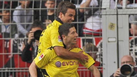 Dortmund's Mario Goetze, from left, and Dortmund's Robert Lewandowski of Poland during the German first division Bundesliga soccer match between BvB Borussia Dortmund and SC  Freiburg in Dortmund, Germany, Sunday, April 17, 2011. (AP Photo/Frank Augstein)  NO MOBILE USE UNTIL 2 HOURS AFTER THE MATCH, WEBSITE USERS ARE OBLIGED TO COMPLY WITH DFL-RESTRICTIONS, SEE INSTRUCTIONS FOR DETAILS