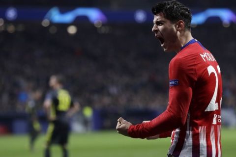 Atletico forward Alvaro Morata reacts after scoring his side's opening goal but the goal was disallowed after a review by VAR during the Champions League round of 16 first leg soccer match between Atletico Madrid and Juventus at Wanda Metropolitano stadium in Madrid, Wednesday, Feb. 20, 2019. (AP Photo/Manu Fernandez)