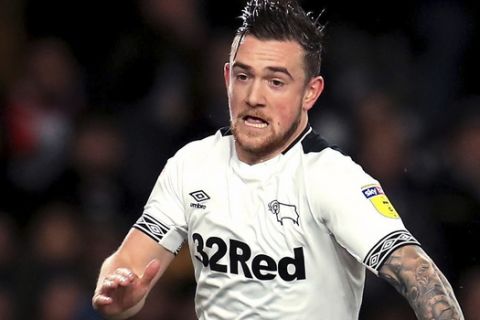 Derby County's Jack Marriott , left, in action during the Sky Bet Championship match at Pride Park, Derby, Monday December 17, 2018. (Mike Egerton/PA via AP)