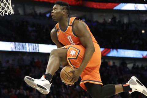 U.S. forward Zion Williamson, of the New Orleans Pelicans, goes up for a dunk during the second half of the NBA Rising Stars basketball game in Chicago, Friday, Feb. 14, 2020. (AP Photo/Nam Y. Huh)