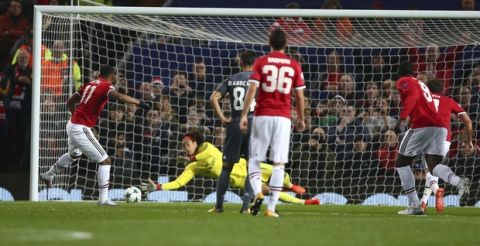 Benfica goalkeeper Mile Svilar saves a penalty took by Manchester United's Anthony Martial, left, during the Champions League group A soccer match between Manchester United and Benfica, at Old Trafford, in Manchester, England, Tuesday, Oct. 31, 2017. (AP Photo/Dave Thompson)
