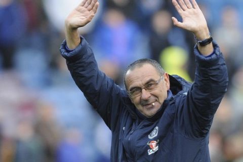 Chelsea's manager Maurizio Sarri waves to his sides fans after the end of the English Premier League soccer match between Burnley and Chelsea at Turf Moor stadium in Burnley, England, Sunday, Oct. 28, 2018. Chelsea won the game 4-0. (AP Photo/Rui Vieira)