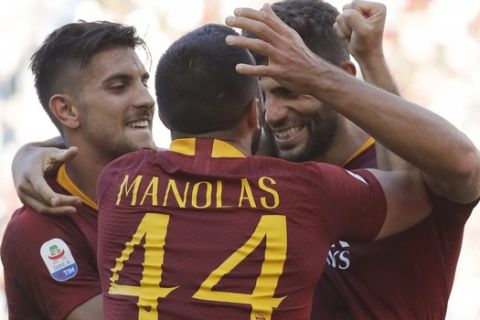 Roma's Federico Fazio, right, celebrates with his teammate Kostas Manolas after scoring his side's second goal during the Serie A soccer match between Roma and Lazio, at the Rome Olympic Stadium, Saturday, Sept. 29, 2018. (AP Photo/Andrew Medichini)