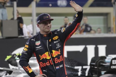 Red Bull driver Max Verstappen of the Netherland's waves after the qualifying session at the Yas Marina racetrack in Abu Dhabi, United Arab Emirates, Saturday, Nov. 30, 2019. The Emirates Formula One Grand Prix will take place on Sunday. (AP Photo/Hassan Ammar)