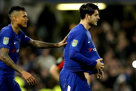 Chelsea's Alvaro Morata, right, celebrates with his teammates after scoring his sides second goal of the game during the English League Cup quarterfinal soccer match between Chelsea and Bournemouth at Stamford Bridge stadium in London, Wednesday, Dec. 20, 2017.Chelsea won the game 2-1. (AP Photo/Alastair Grant)