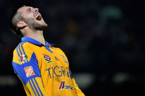 Tigres's forward Andre Pierre Gignac celebrates after defeating Pumas by penalties during their Mexican Apertura tournament football final match at the Olimpic stadium on December 13, 2015 in Mexico City.  AFP PHOTO/ Yuri CORTEZ / AFP / YURI CORTEZ        (Photo credit should read YURI CORTEZ/AFP/Getty Images)