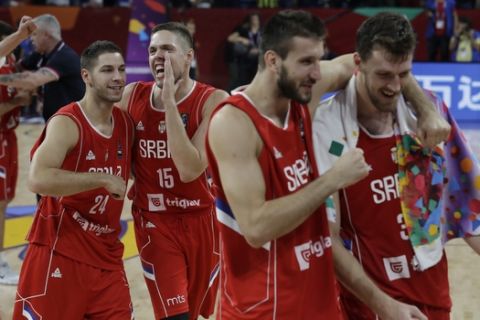 Players of Serbia celebrate after their Eurobasket European Basketball Championship quarterfinal match against Italy in Istanbul, Wednesday, Sept. 13. 2017. (AP Photo/Lefteris Pitarakis)